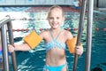 Little girl with swimming sleeves