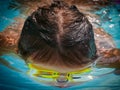 Little girl swimming underwater in the pool Royalty Free Stock Photo