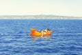 A little girl swims in the sea in a disposable mask Royalty Free Stock Photo