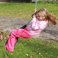 Little girl on a swing