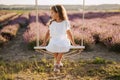 Little Girl on Swing Lavender Field Background