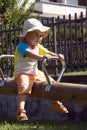 Little girl on swing in park