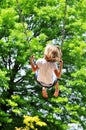 Little girl swinging Royalty Free Stock Photo