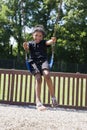 Little girl swinging at the park Royalty Free Stock Photo