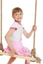 Little girl swinging on a swing Royalty Free Stock Photo