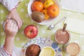 Little girl taking beakfast at home, top view. Children nourishment concept an empty copy space.