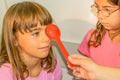 Little girl is taking the eye exam test Royalty Free Stock Photo