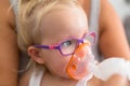 Little girl is taking inhalation therapy Royalty Free Stock Photo