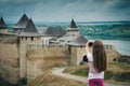 Little girl taking a photo in front of Khotyn Royalty Free Stock Photo