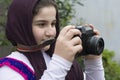 Little Girl Is Taking Photograph by An old Analogue Camera Strap Royalty Free Stock Photo