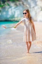 Little girl taking selfie by her smartphone on the beach. Royalty Free Stock Photo