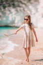 Little girl taking selfie by her smartphone on the beach. Royalty Free Stock Photo