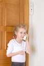 Little girl talking on the intercom Royalty Free Stock Photo