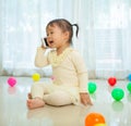 Little girl talking on mobile phone