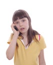 The little girl talks by a mobile phone. Surprise