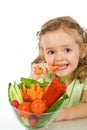 Little girl tasting and chomping a carrot Royalty Free Stock Photo