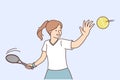 Little girl tennis player trains by hitting ball with racket, wanting to score goal for opponent Royalty Free Stock Photo