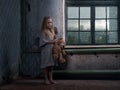 A little girl in a terribly dirty beggar& x27;s house Royalty Free Stock Photo