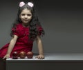 Little girl with three pomegranates in front of her happy yalda theme