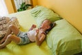 a little girl of three years crying lying in bed. bad mood children& x27;s whims. Royalty Free Stock Photo