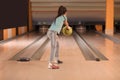 Little girl throwing ball at bowling Royalty Free Stock Photo