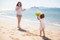 Little girl throwing beach ball Royalty Free Stock Photo