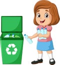 Little girl throwing trash into litter bin