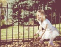 Little Girl Throws Leaves Royalty Free Stock Photo