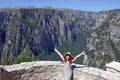 Little girl with thumbs up on the viewpoint Vikos gorge Gr