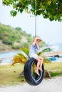 Little girl on tire swing Royalty Free Stock Photo