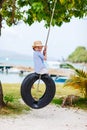 Little girl on tire swing Royalty Free Stock Photo