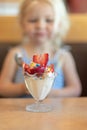 Little girl about to dig in to an ice cream sundae Royalty Free Stock Photo