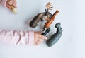 Little girl toddler playing with animal toys on table in children`s room at home, view fron top Royalty Free Stock Photo