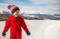 Little girl is on the top of Kokhta mount in Bakuriani, winter time