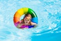 Little girl with toy ring in swimming pool Royalty Free Stock Photo