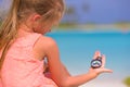 Little girl traveler with a compass in the hand on Royalty Free Stock Photo