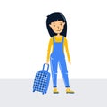 Little girl traveler stands, holding a suitcase on wheels. Ready to travel red hair teenager girl. Waiting for travel in