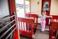 Little girl travellling by old train Kukushka in Georgia between Bakuriani and Borjomi Royalty Free Stock Photo