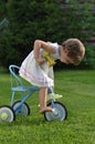 Little girl on the tricycle