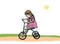 Little girl on a tricycle