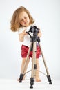 Little girl with tripod Royalty Free Stock Photo