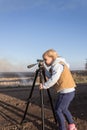 Little girl with a tripod Royalty Free Stock Photo