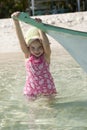 Little girl tropical beach FUN boat Royalty Free Stock Photo
