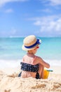 Little girl at tropical white beach making sand castle Royalty Free Stock Photo