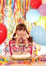 Little girl with trumpet and cake birthday party Royalty Free Stock Photo