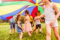 Little girl trying to join active game of older kids Royalty Free Stock Photo