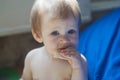 A little girl is trying to taste snacks Royalty Free Stock Photo