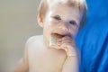 A little girl is trying to taste snacks. Royalty Free Stock Photo