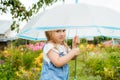 Little girl with umbrella playing in the rain. Autumn outdoor fun for children. Toddler kid outside in the garden. Baby Royalty Free Stock Photo