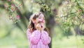 Little girl under blooming apple tree Royalty Free Stock Photo